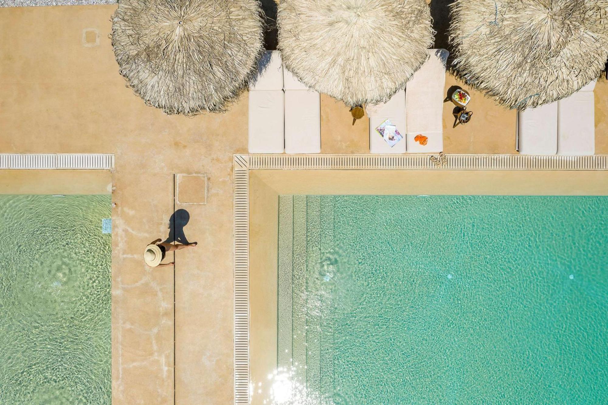Isla Brown Corinthia Resort & Spa, Curio Collection By Hilton Agioi Theodoroi Exterior foto Aerial view of the pool